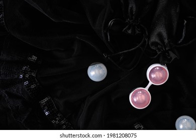 Vaginal pleasure balls Ben Wa, Kegel balls on black background, top view