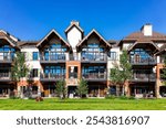 Vail Colorado lodge hotel condo building of European Swiss style ski resort town, apartment building with balcony in summer