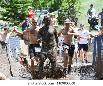 Vail, Colorado / USA - 06-09-18: GoPro Mountain Games Mud Run, Participants Running Through Mud Pits And Passed The Mud Stud