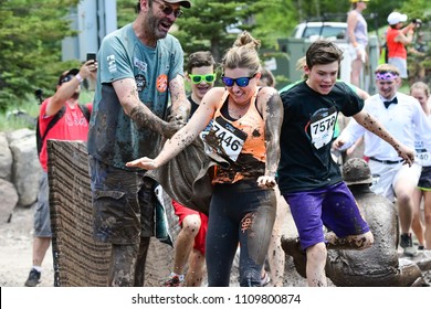 Vail, Colorado / USA - 06-09-18: GoPro Mountain Games Mud Run, Participants Running Through Mud Pits And Passed The Mud Stud