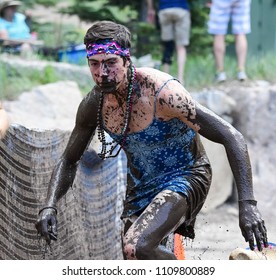 Vail, Colorado / USA - 06-09-18: GoPro Mountain Games Mud Run, Participants Running Through Mud Pits And Passed The Mud Stud