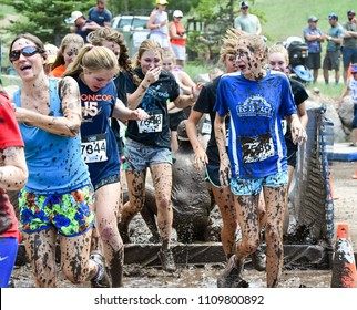 Vail, Colorado / USA - 06-09-18: GoPro Mountain Games Mud Run, Participants Running Through Mud Pits And Passed The Mud Stud