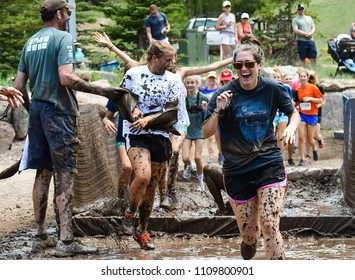 Vail, Colorado / USA - 06-09-18: GoPro Mountain Games Mud Run, Participants Running Through Mud Pits And Passed The Mud Stud