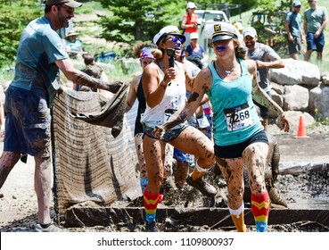 Vail, Colorado / USA - 06-09-18: GoPro Mountain Games Mud Run, Participants Running Through Mud Pits And Passed The Mud Stud