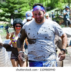 Vail, Colorado / USA - 06-09-18: GoPro Mountain Games Mud Run, Participants Running Through Mud Pits And Passed The Mud Stud