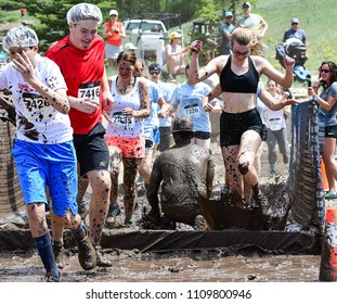 Vail, Colorado / USA - 06-09-18: GoPro Mountain Games Mud Run, Participants Running Through Mud Pits And Passed The Mud Stud