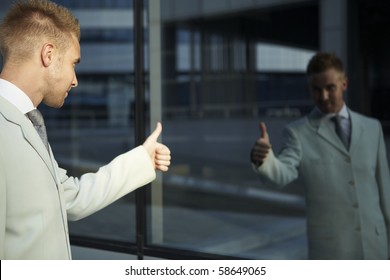 Vain Business Man Checking His Looks In The Mirror