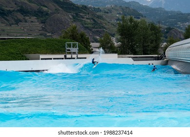 Valais, Sion, Switzerland - 9 June 2020: Surf Wave Pool In Switzerland. Alaia Bay And Wave Garden In Sion, French Part Of Switzerland. Surf In The Swiss Alps.