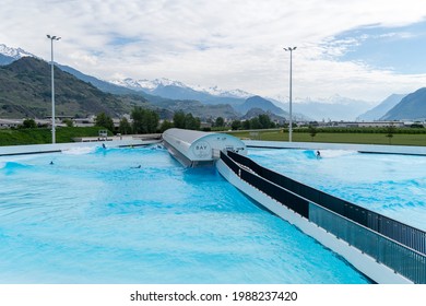 Valais, Sion, Switzerland - 9 June 2020: Surf Wave Pool In Switzerland. Alaia Bay And Wave Garden In Sion, French Part Of Switzerland. Surf In The Swiss Alps.