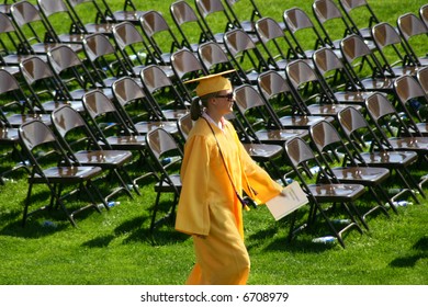 The Valedictorian For A Graduating Class Marches To Her Place At The Head Of The Class.