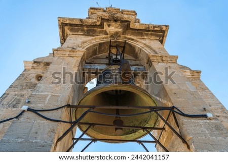 Valencia Cathedral, large bell on the Bell Tower, known as Miguelete Tower. The Gothic Cathedral in Valencia, Spain is also known as St Mary's Cathedral, a Roman Catholic church in Plaza de la Reina.