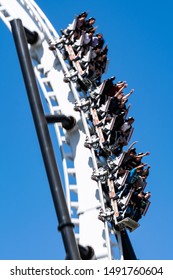 VALENCIA, CA/USA - AUGUST 08, 2019. Six Flags Magic Mountain. People Seeking Thrill Riding A Roller Coaster 