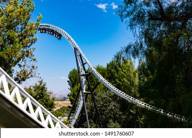 VALENCIA, CA/USA - AUGUST 08, 2019. Six Flags Magic Mountain. People Seeking Thrill Riding A Roller Coaster 
