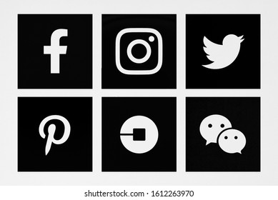 Valencia, Spain - April 22, 2019: Collection of popular social media logos printed on paper: Facebook, Instagram, Twitter, Pinterest,Uber,WeChat.