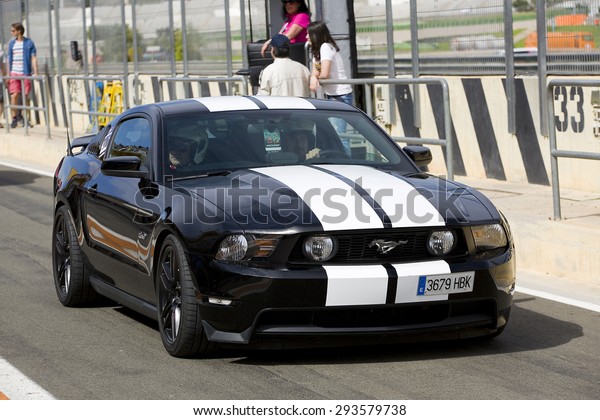 VALENCIA, SPAIN - APRIL\
25: A black 2013 Ford Mustang take part in American Fest weekend\
organizated in circuit Ricardo Tormo, on April 25, 2015, in Cheste,\
Valencia, Spain.