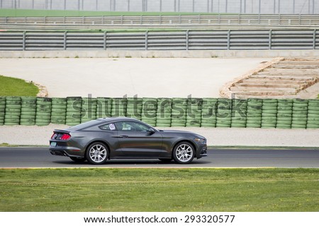 VALENCIA, SPAIN - APRIL 25: A grey 2015 Ford Mustang take part in American Fest weekend organizated in circuit Ricardo Tormo, on April 25, 2015, in Cheste, Valencia, Spain.