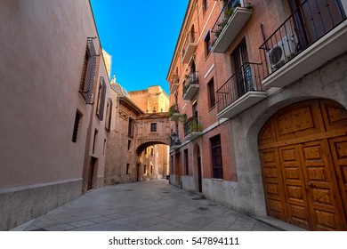 Valencia Spain Architecture With Narrow Street and Arch Bridge