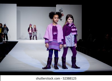 VALENCIA, SPAIN - JANUARY 23: Angelina Fernandez, age 12, and Maria Gutierrez, age 11, of Valencia in the Valencia Children's Fashion Show (designer Girandola) on January 23, 2010 in Valencia, Spain.
