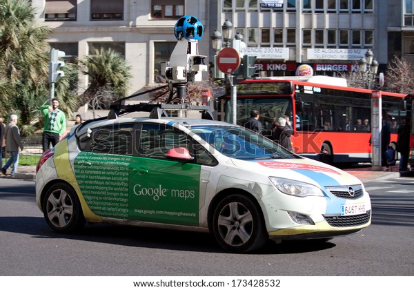 VALENCIA, SPAIN - JANUARY 27, 2014: A Google Street\
View vehicle used for mapping streets throughout the world drives\
through the city center of Valencia. Google Street View started in\
May 2007.