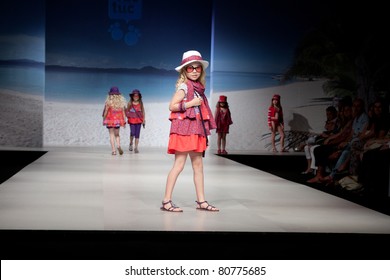 VALENCIA, SPAIN - JULY 1: An unidentified child model on the runway at the FIMI Children's Summer Fashion Show for designer Tuc-Tuc in the Feria Valencia on July 1, 2011 in Valencia, Spain.