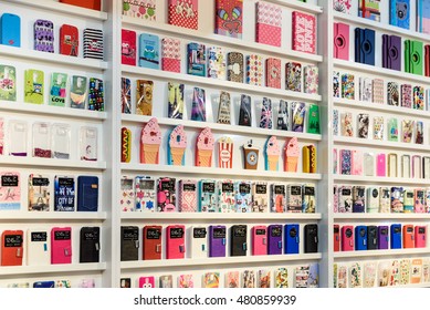 VALENCIA, SPAIN - JULY 23, 2016: Colorful IPhone And Samsung Phone Cases For Sale In Mobile Phones Stores.