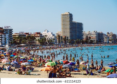 VALENCIA, SPAIN - JULY 28, 2016: People Having Fun In Water And Relaxing In Peniscola Beach Resort At Mediterranean Sea In Spain.