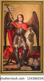 Valencia, Spain - June 15, 2018: Medieval Painting In Valencia, Spain, Depicting Saint Michael The Archangel Slaying Satan