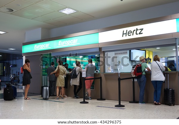 VALENCIA, SPAIN - JUNE 9, 2016:\
Rental car counter at the Valencia, Spain Airport. Approximately\
4.98 million passengers passed through the Valencia airport in\
2015.
