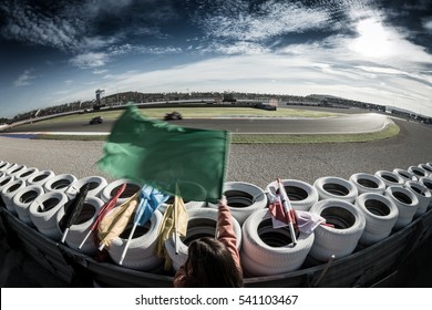 VALENCIA, SPAIN - NOV 12: Race Marshall Wuth Green Flag During Motogp Grand Prix Of The Comunidad Valencia On November 12, 2016 In Valencia, Spain.