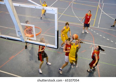 VALENCIA, SPAIN - NOV 14:  Women Basketball Teams, National & Technical University Of Athens (yellow) Plays The University Of Crete In The EuroValencia Games On November 14, 2010 In Valencia, Spain.