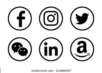 Valencia, Spain - October 10, 2018: Collection of popular social media logos printed on paper: Facebook, Instagram, Twitter, WeChat, LInkedin, Amazon. 