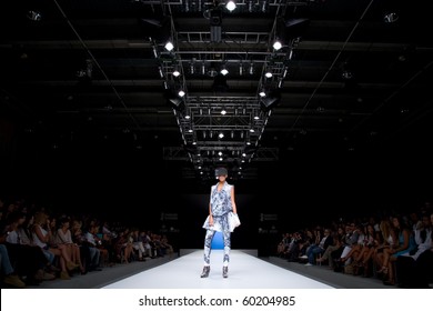 VALENCIA, SPAIN - SEPTEMBER 1: A model on the catwalk wears a Zazo & Brull design for the Valencia Fashion Week on September 1, 2010 in Valencia, Spain.