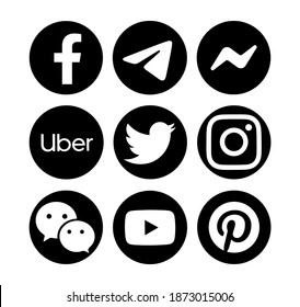 Valencia, Spain - September 13, 2020:  Collection of popular social media logos printed on paper: Facebook, Instagram, Telegram, Uber, YouTube, Messenger,Twitter, WeChat, Pinterest.