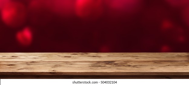 Valentine Background In Red In Front Of An Empty Wooden Table