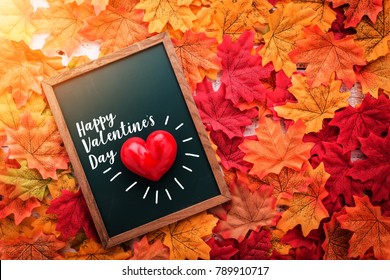 Valentine concept red heart shape object chalkboard autumn leaf texture background love concept