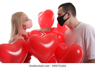 Valentine couple with mask.Saint Valentine's Day,  romantic relationship, Valentine day, love and happiness concept.Happy couple isolated on white background.