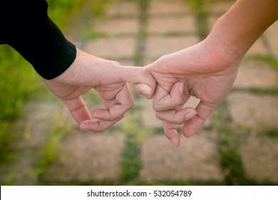 Valentine day background. Happy couple holding hands together as forever love. Vintage filter. - Shutterstock ID 532054789