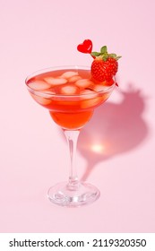 Valentine Day Cocktail With Strawberry In Martini Glass On Pink Background