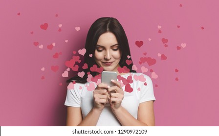 Valentine day concept, love mail - hearts flying out smartphone in womans hands - Shutterstock ID 1290972109