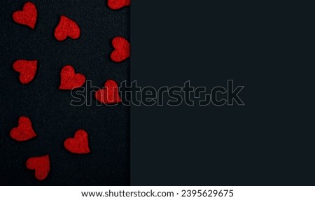 Valentine day greeting card or banner. Red hearts on black background top view. Flat lay. Copy Space