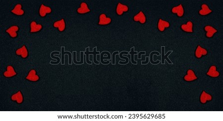 Valentine day greeting card or banner. Red hearts on black background top view. Flat lay. Copy Space