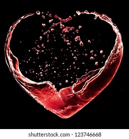 Valentine Day Heart Made Of Red Wine Splash Isolated On Black Background