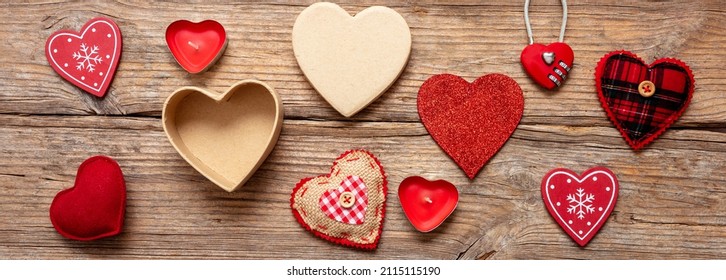 Valentine Day Love Symbol Nine Red Various Texture Heart Shaped And Open Gift Box On Wooden Background. Banner. Overhead View.