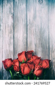 Valentine: Dozen Roses With Lots Of Copyspace On Wooden Background