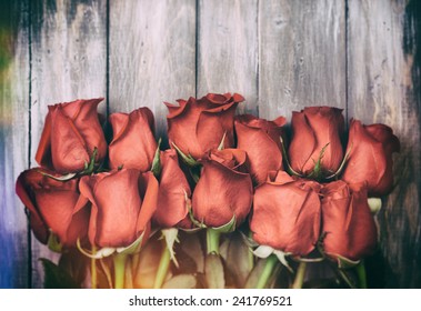 Valentine: Grunge Dozen Of Roses On Rustic Background