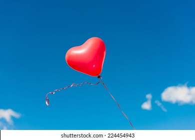 Valentine Heart Balloon Against Blue Sky Background