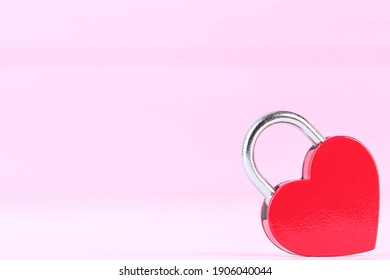 Valentine heart shaped padlock on pink background - Shutterstock ID 1906040044