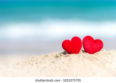 Valentine And Marry Concept.  Two Red Hearts Couple Lovers For Married Wedding In Summer Day On Sand Paradise Tropical Beach, Travel Blue Background.