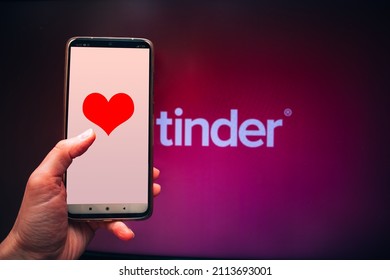 Valentine's Day, Applications For Online Dating Tinder, Phone In Hand With A Heart On The Screen Against