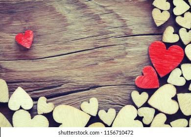 valentines day background, border plywood heart on wooden table, vintage style, flat lay
